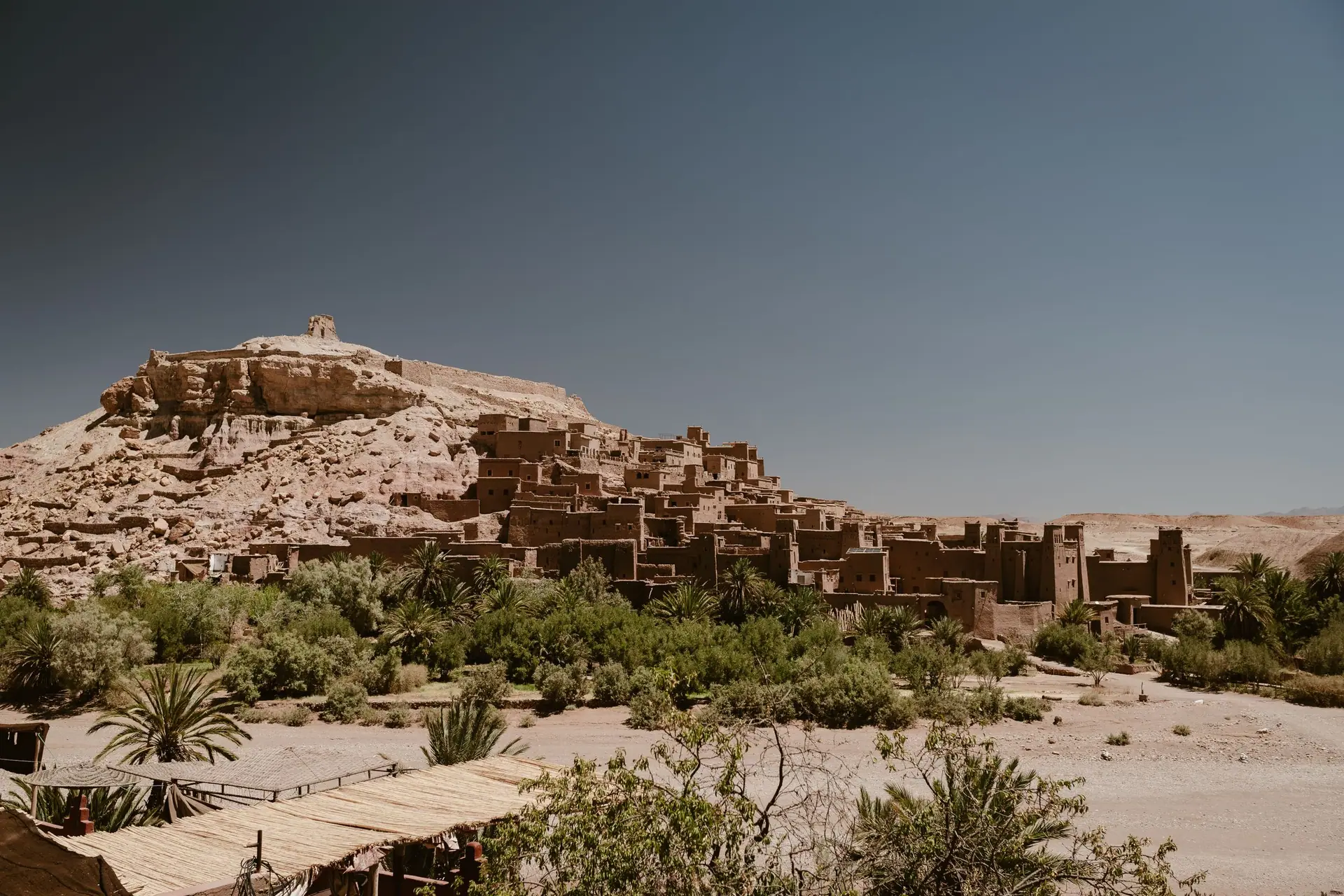 Stunning view of Ksar Ait Ben Haddou in Morocco's Draa-Tafilalet region under a clear blue sky.