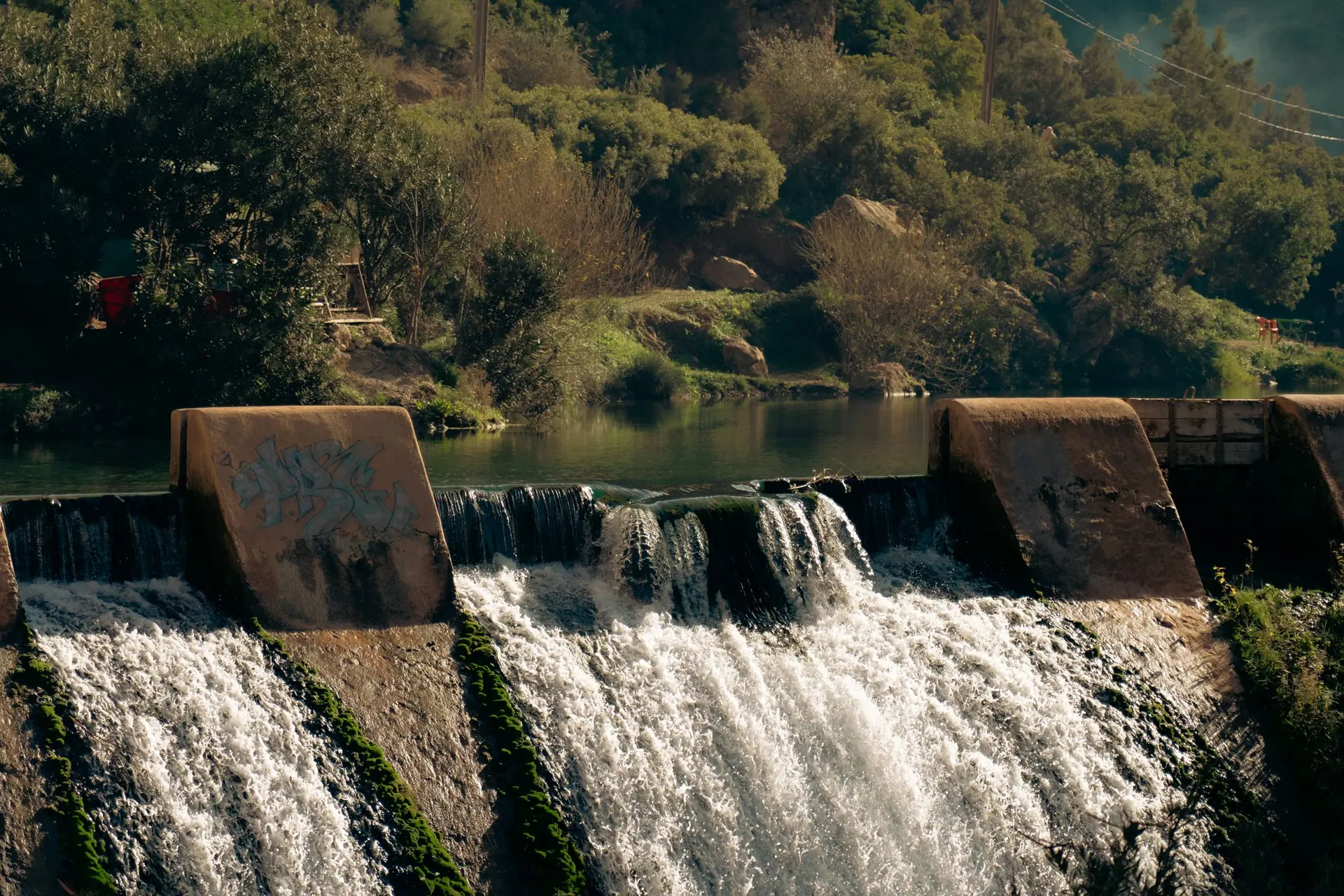 Captivating waterfall scenery in Akchour, Morocco with lush greenery and flowing waters.